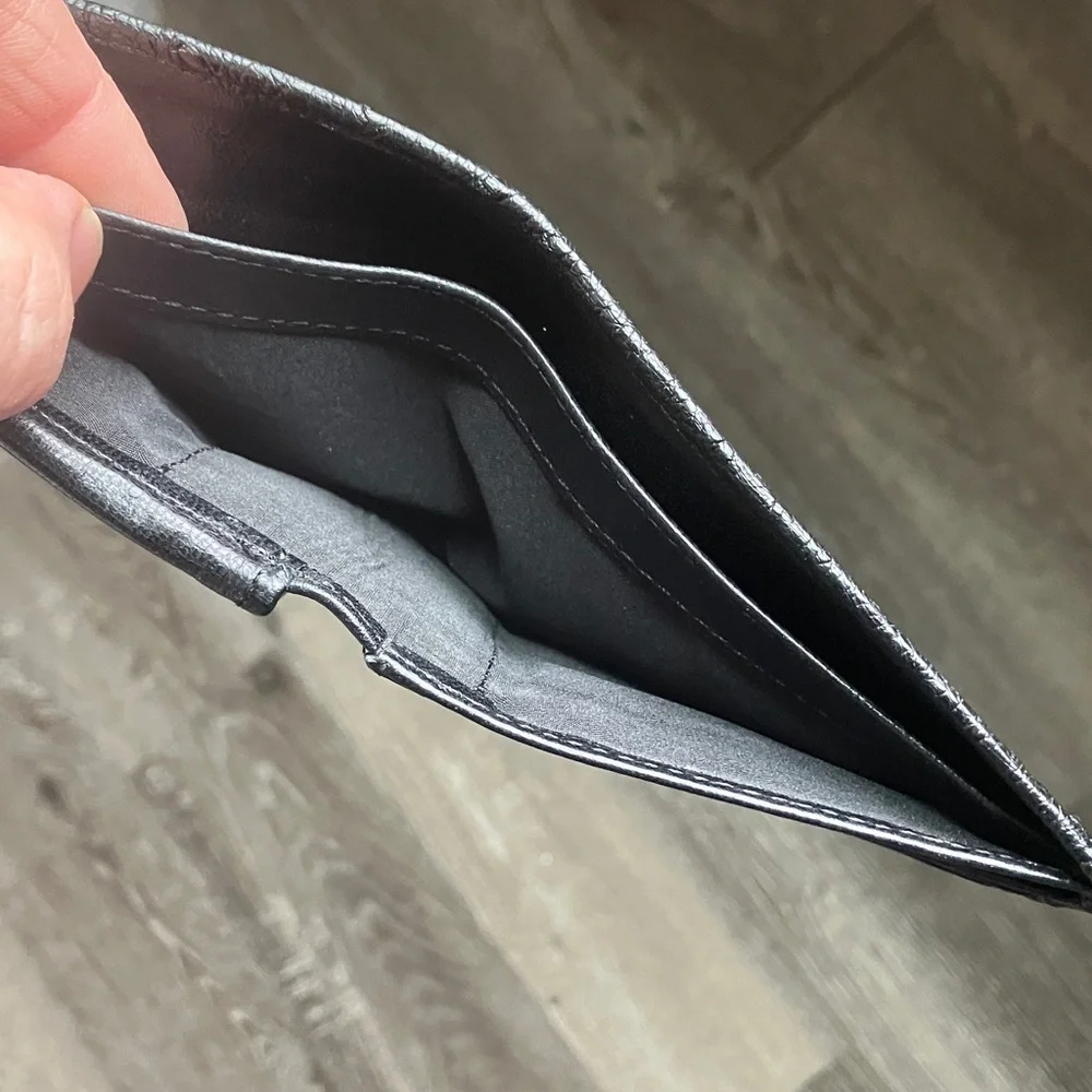 black bifold wallet made from genuine ostrich leather.